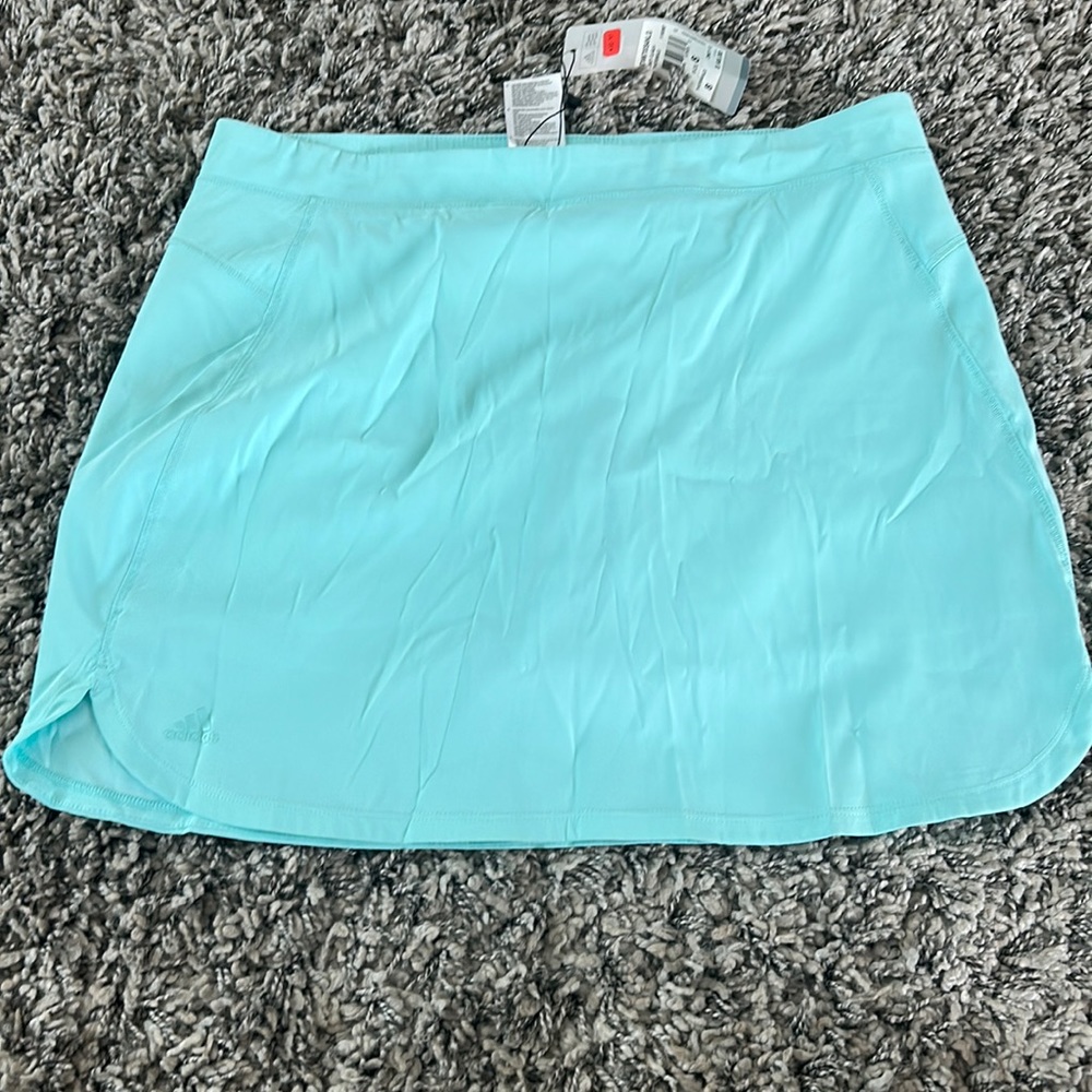 Adidas sport skirt short. Color is teal. Size 8